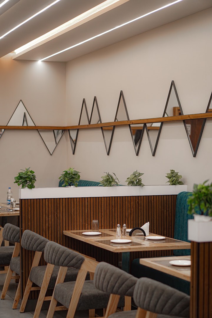 Renuka Nxt Family Restaurant logo